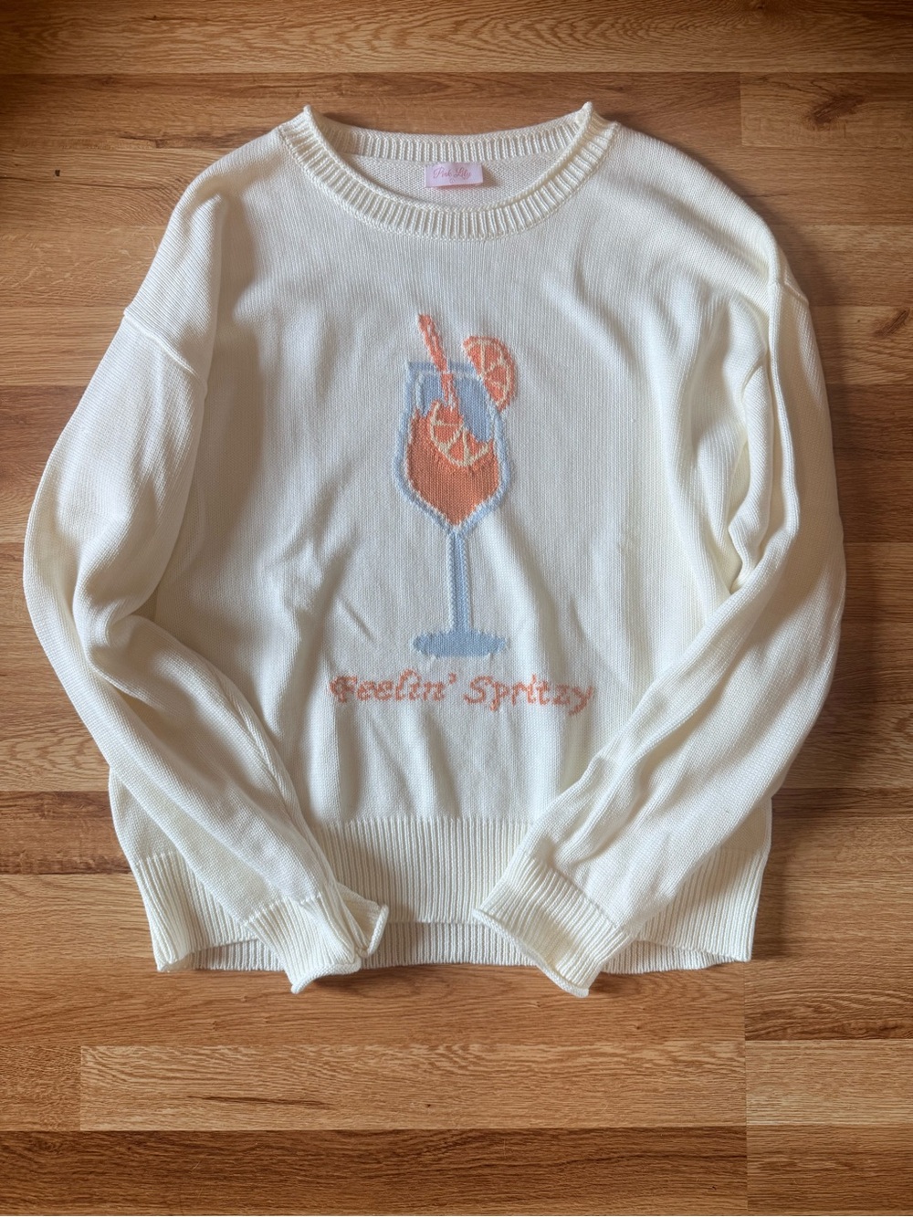 Pink Lily Cream Sweater with Coral & Light Blue Cocktail Graphic